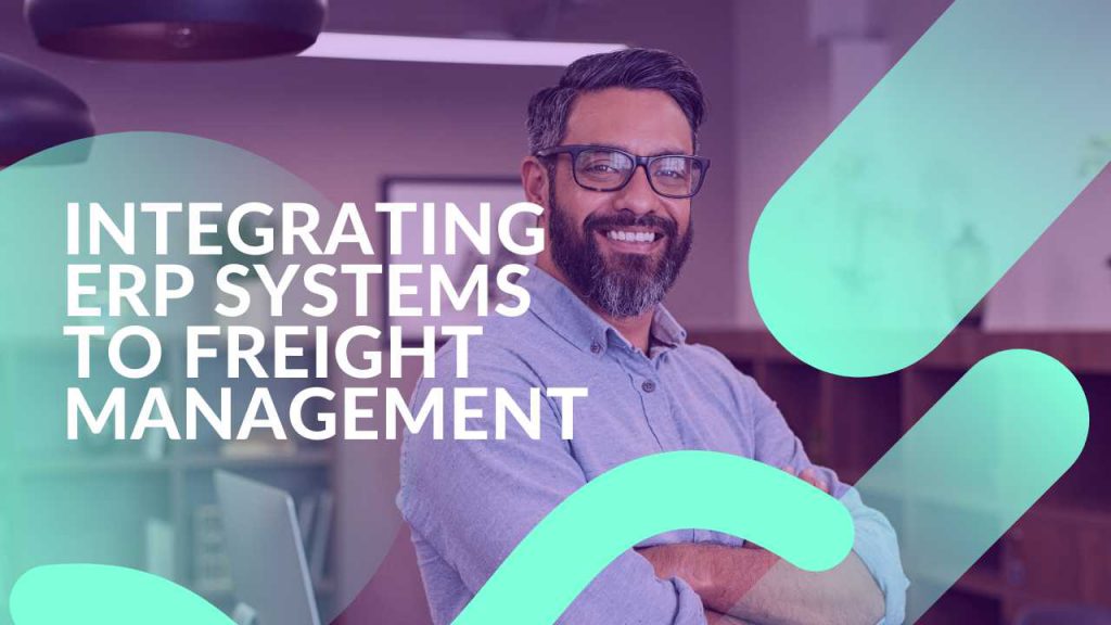 A man with glasses and a beard stands confidently with arms crossed in an office setting. The text reads, "Integrating ERP Systems to Freight Management." The image has abstract teal shapes overlaying it.